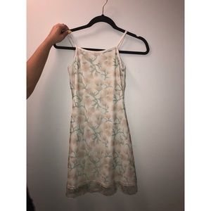 White mini dress w/ peachy floral print